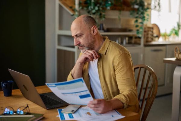 Person reviewing financial statements to determine if a forensic accountant is needed in divorce